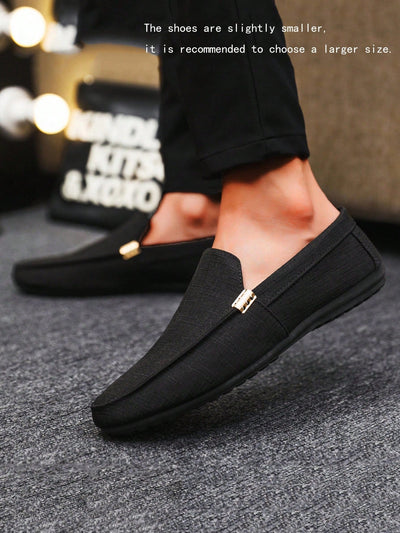 Men's black casual loafers, slip-on canvas moccasins with plain round toe.