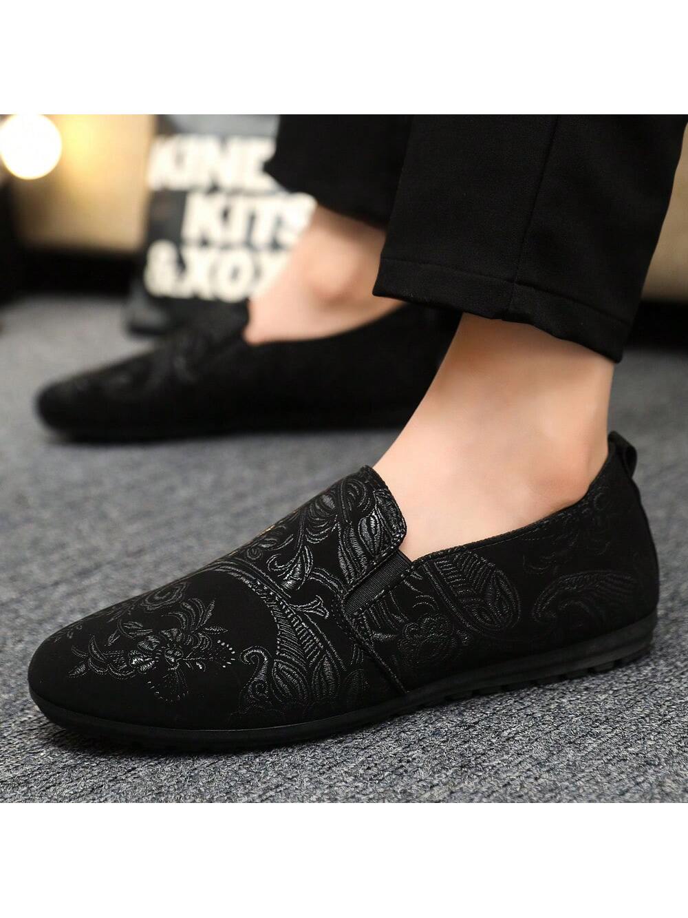 Fashionable black men's loafers with printed upper design and lace-up style.