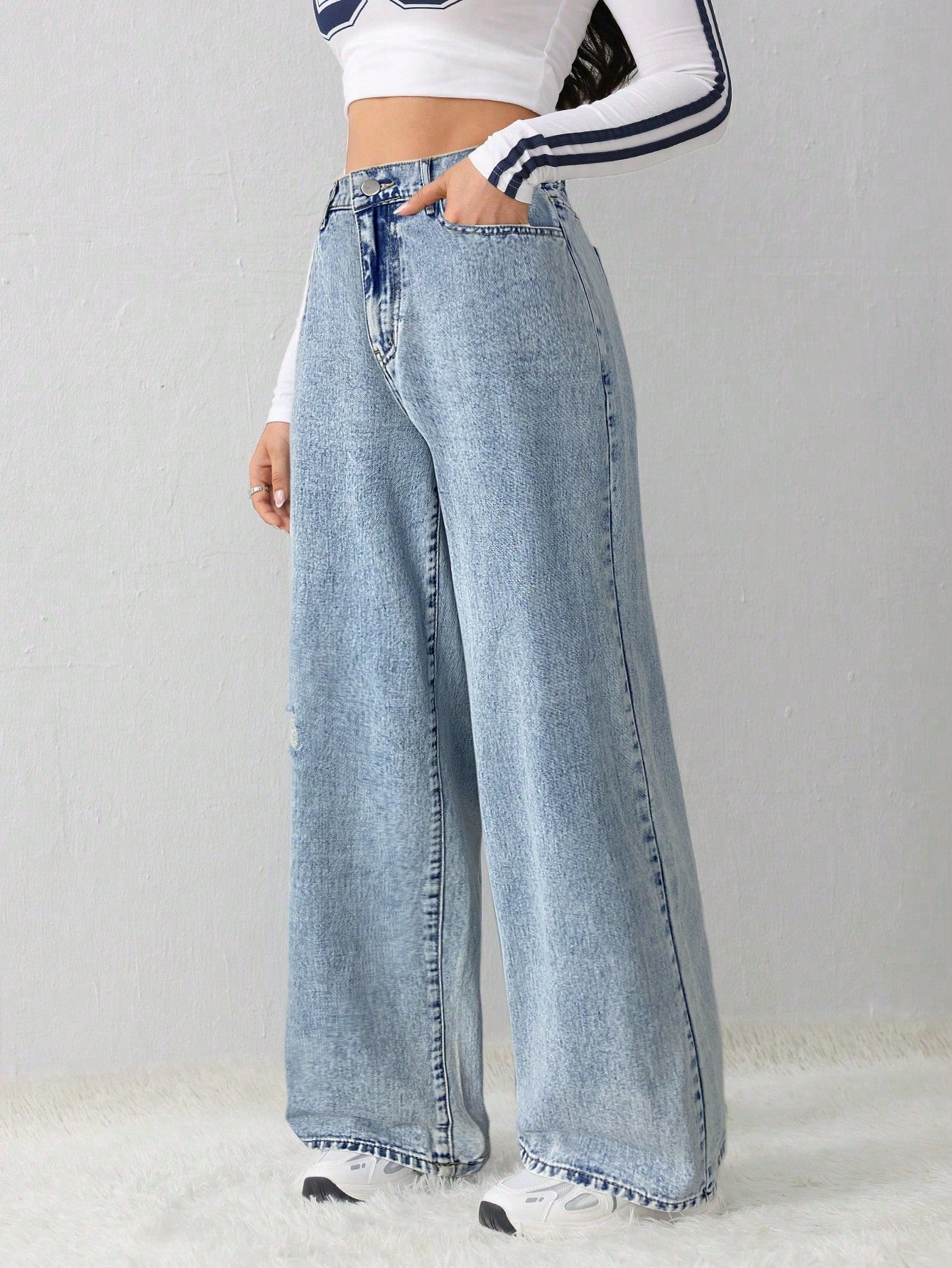 Women's high waist wide leg denim jeans, medium wash, casual style.